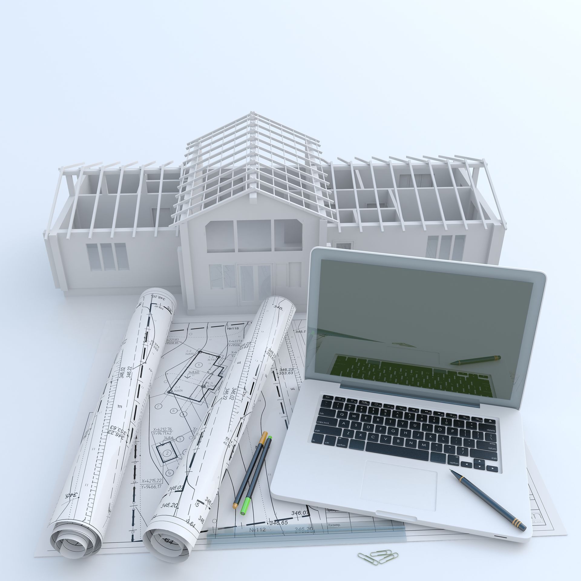 Architectural drawings, laptop, house model in 3D